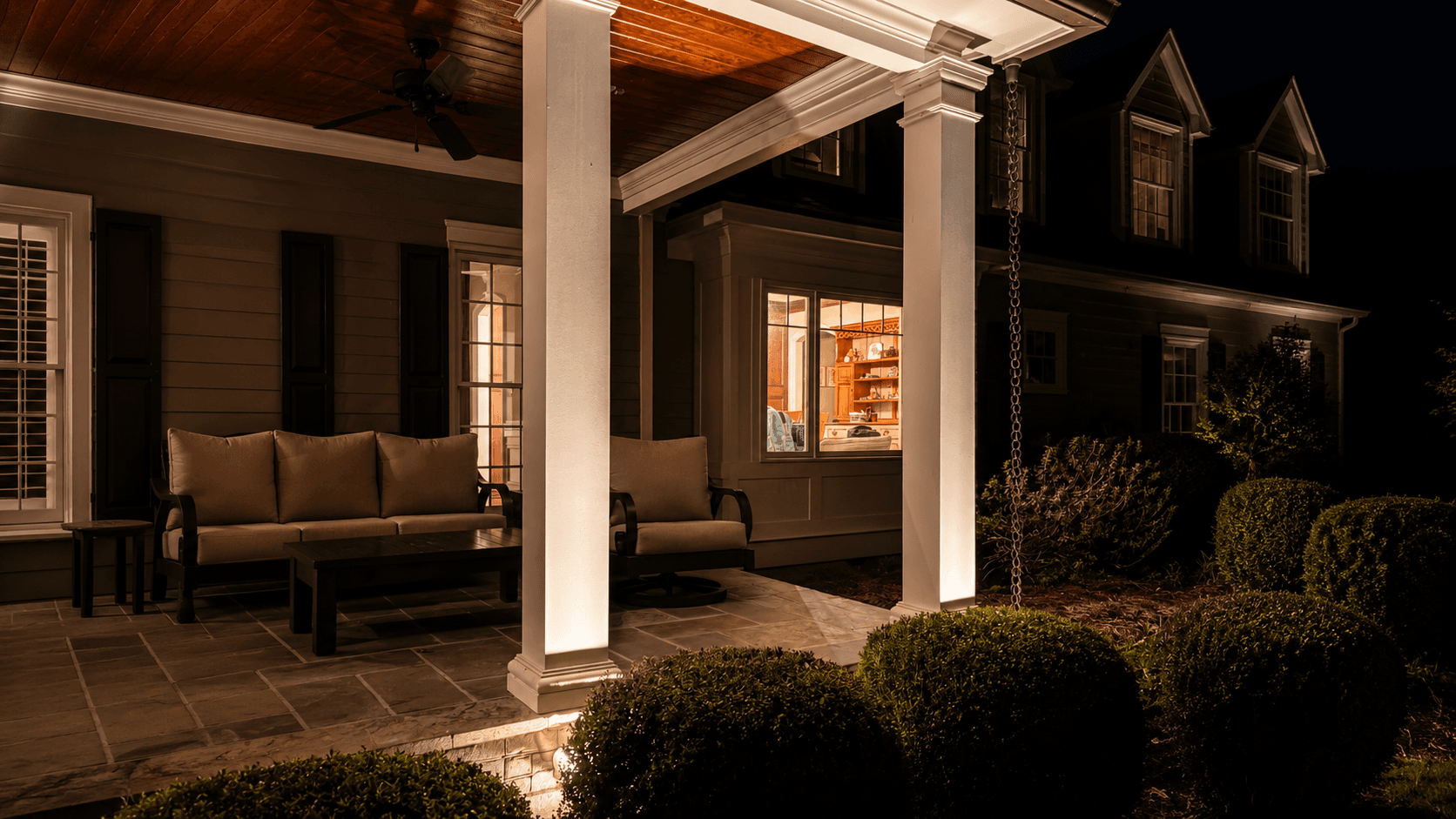 Outdoor living area with architectural lighting at night